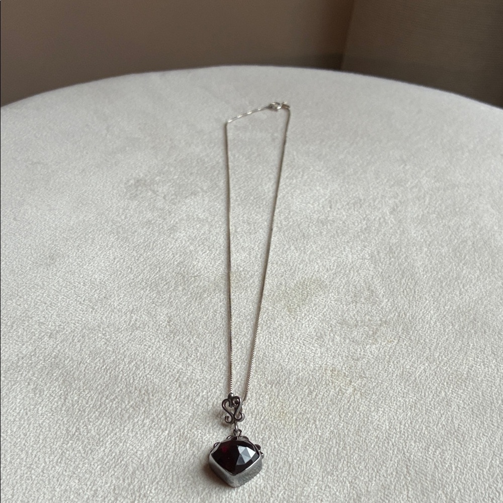 Elegant Silver Necklace with Dark Red Pendant